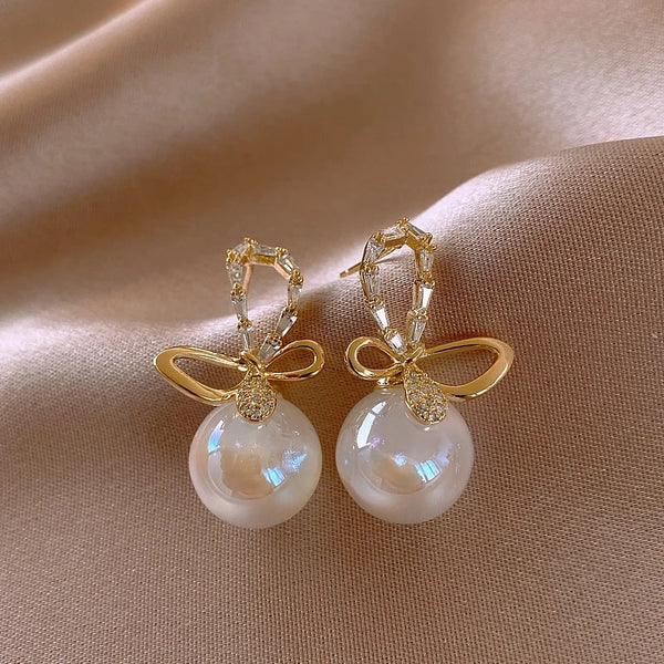 Elegant Temperament Butterfly Shaped Magic Pearl Gold Colour Earrings